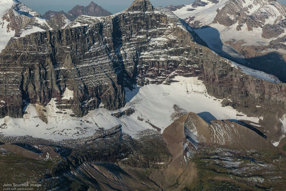 Islands are sinking and eroding as glaciers melt away. Officials in Glacier National Park bemoan the lost of ... glaciers! The park's team says this in the overview of the problem, "It has been estimated that there were approximately 150 glaciers present in 1850, around the end of the Little Ice Age and most glaciers were still present in 1910 when the park was established. In 2015, measurements of glacier area indicate that there were 26 remaining glaciers larger than 25 acres, the size criteria used by USGS researchers to define a glacier."
The bigger picture? Not good.
"Glaciers are key and unique indicators of global warming and climate change. They are also an integral part of the culture, landscape, and environment, and an important component of the hydrological cycle in high mountain regions. In 2014, IPCC confirmed with a high degree of confidence that glaciers have continued to shrink almost worldwide and that these changes will affect water availability for the large populations situated downstream," the World Glacier Monitoring Service wrote in its Global Glacier Change Bulletin.
Photo: Large moraines at the base of Logan Glacier (2016) mark the extent of the glacier before it began its retreat around 1850 AD. Photo: John Scurlock/USGS / John Scurlock