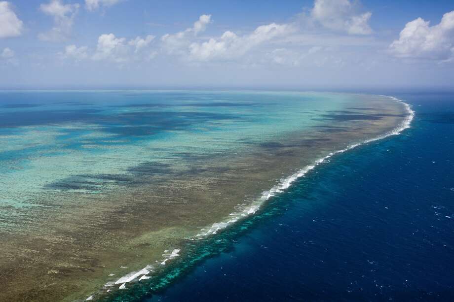 The Great Barrier Reef murder: Climate change has wiped out half of the reef since 2016; and things are looking bad for this coming summer. The recent study "Global warming transforms coral reef assemblages" adds, direly:
"The 2015–2016 global bleaching event is a watershed for the Great Barrier Reef, and for many other severely affected reefs elsewhere in the Indo-Pacific Ocean. Furthermore, the Great Barrier Reef experienced severe bleaching again in early 2017, causing additional extensive damage. The most likely scenario, therefore, is that coral reefs throughout the tropics will continue to degrade over the current century until climate change stabilizes."
Photo: Aerial view of the Great Barrier Reef, Queensland, Australia. Photo: Ullstein Bild/ullstein Bild Via Getty Images