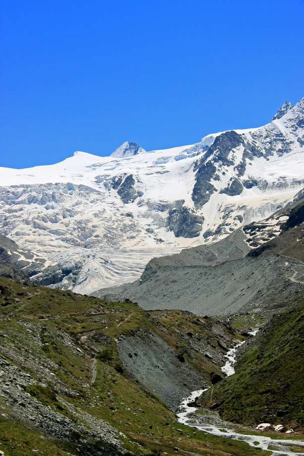 We'll miss those glaciers, and the bugs threatened by the loss of glaciers and snowpack. The study "Climate‐induced glacier and snow loss imperils alpine stream insects" says, "Climate warming is causing rapid loss of glaciers and snowpack in mountainous regions worldwide. These changes are predicted to negatively impact the habitats of many range‐restricted species, particularly endemic, mountaintop species dependent on the unique thermal and hydrologic conditions found only in glacier‐fed and snow melt‐driven alpine streams. ...  highlighting the role of mountaintop aquatic invertebrates as sentinels of climate change in mid‐latitude regions."
Photo: View of the Zinal and the Moiry Glaciers in summer in the Val d'Anniviers, Switzerland. Photo: Andia/UIG Via Getty Images