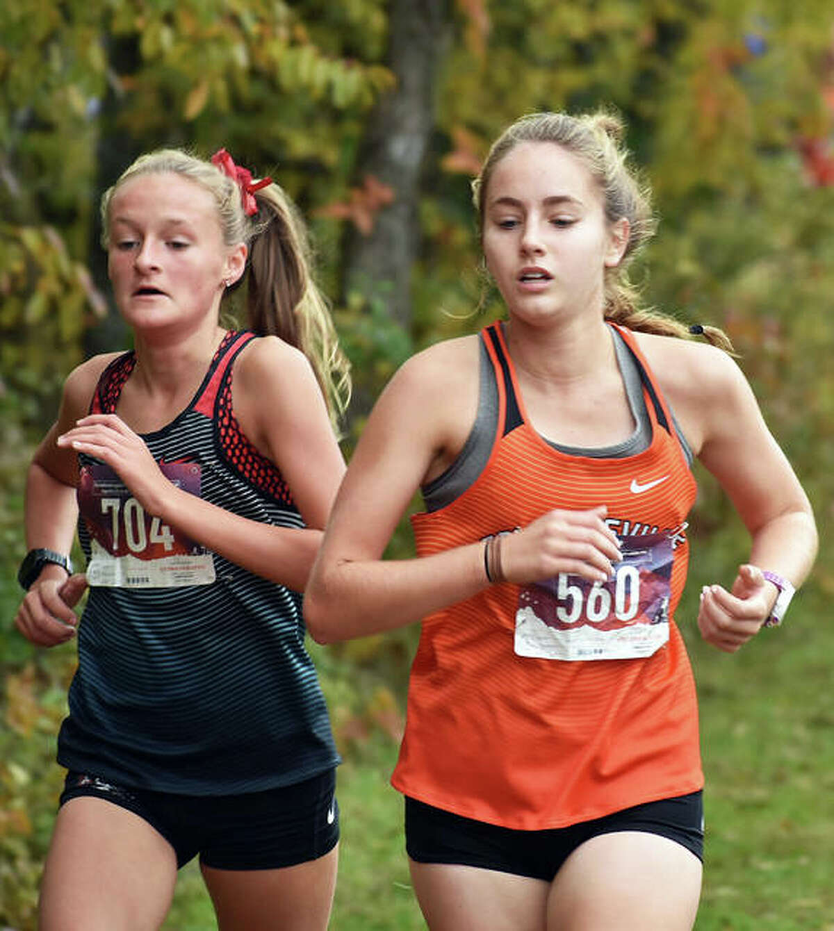 Edwardsville’s Hannah Stuart, right, completes the first mile of the Class 3A Quincy Sectional.