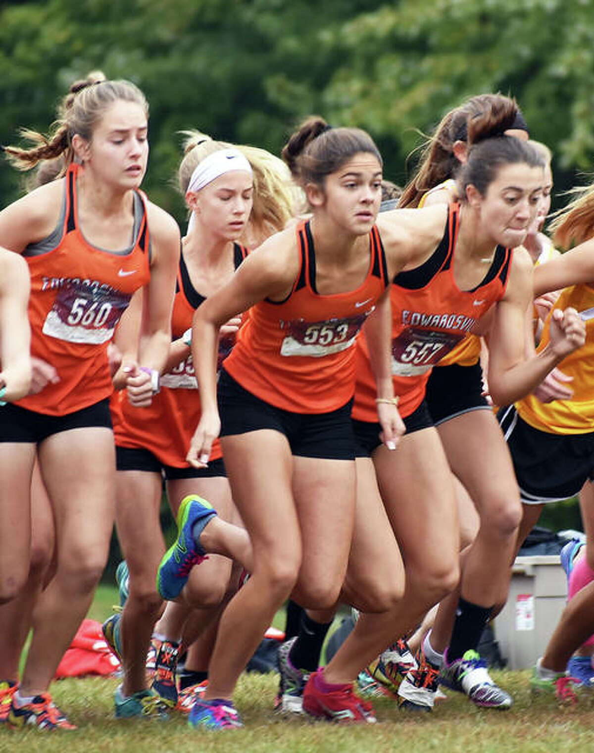 Edwardsville’s Hannah Stuart, left, Abby Korak, center, and Maddie Miller take off from the starting line at the Class 3A Quincy Sectional.