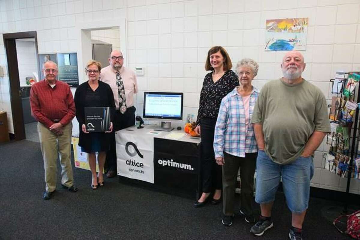 Sullivan Senior Center members gather at a recent ribbon cutting event to help raise awareness for Altice Advantage Internet, a low-cost Internet option for eligible families and senior citizens. As part of the partnership, Altice USA is providing the senior center with free broadband connectivity to give community members access to the Internet at no charge while they visit. From left are Sullivan Senior Center members; Torrington Mayor Elinor Carbone; center director Joel Sekorski,; Laura Jordan, Government Affairs Director, Altice USA; and center members.