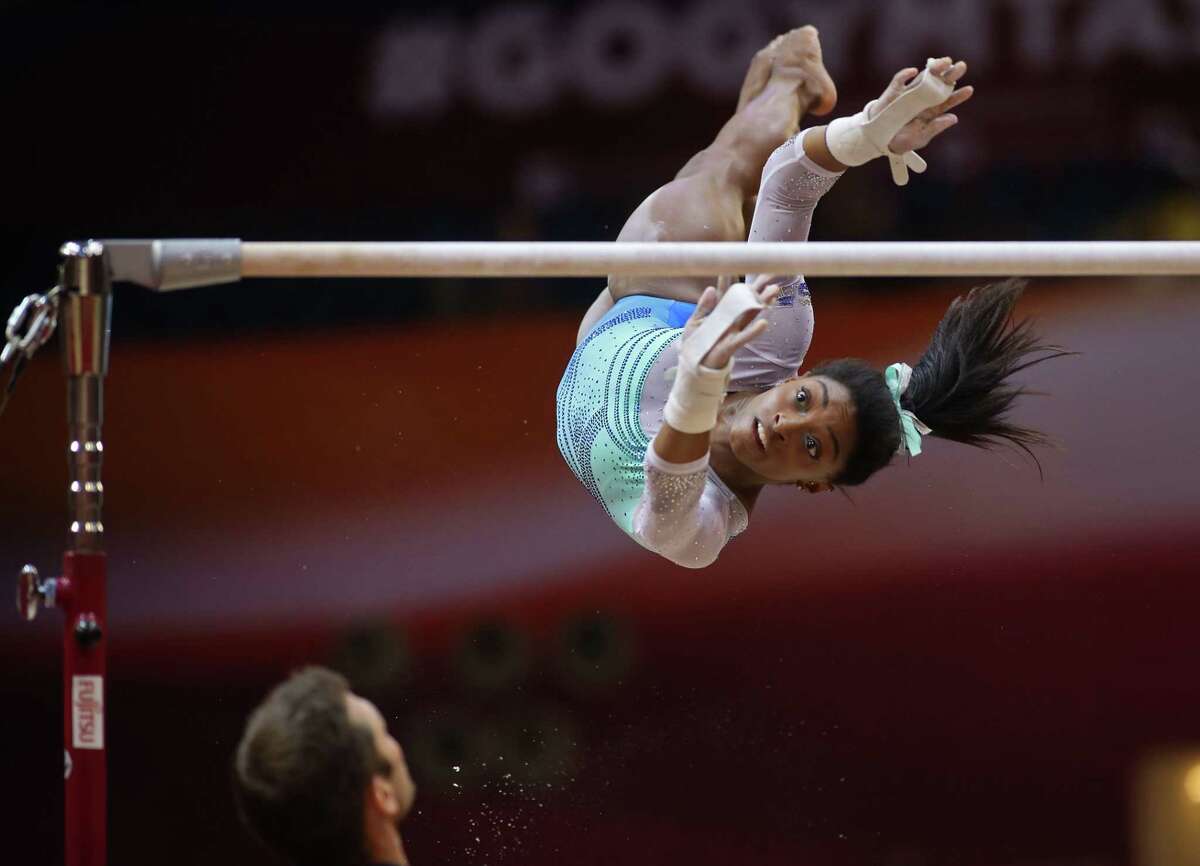 US' Simone Biles competes in the women's all-around final of the 2018 FIG Artistic Gymnastics Championships at the Aspire Dome on November 1, 2018 in Doha. (Photo by KARIM JAAFAR / AFP)KARIM JAAFAR/AFP/Getty Images