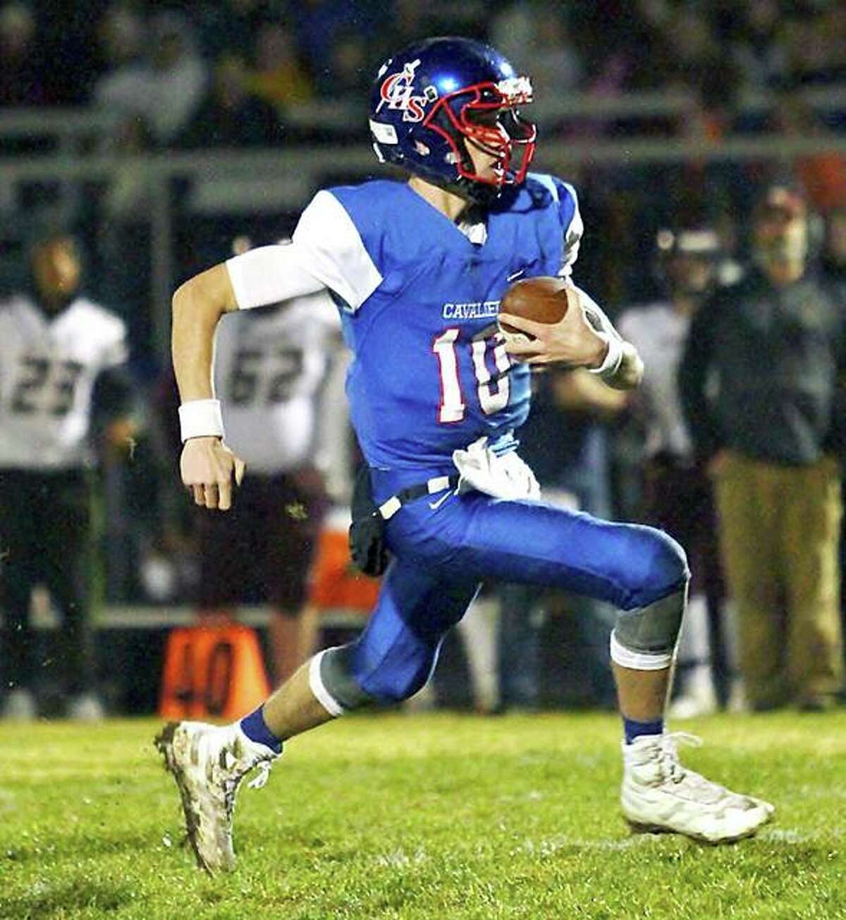 Carlinville quarterbck Jarret Easterday runs for yardage in last week’s first-round playoff victory over East Alton-Wood River. The Cavies will travel to Paxton Saturday for a 2 p.m. second-round game against Buckley-Loda.