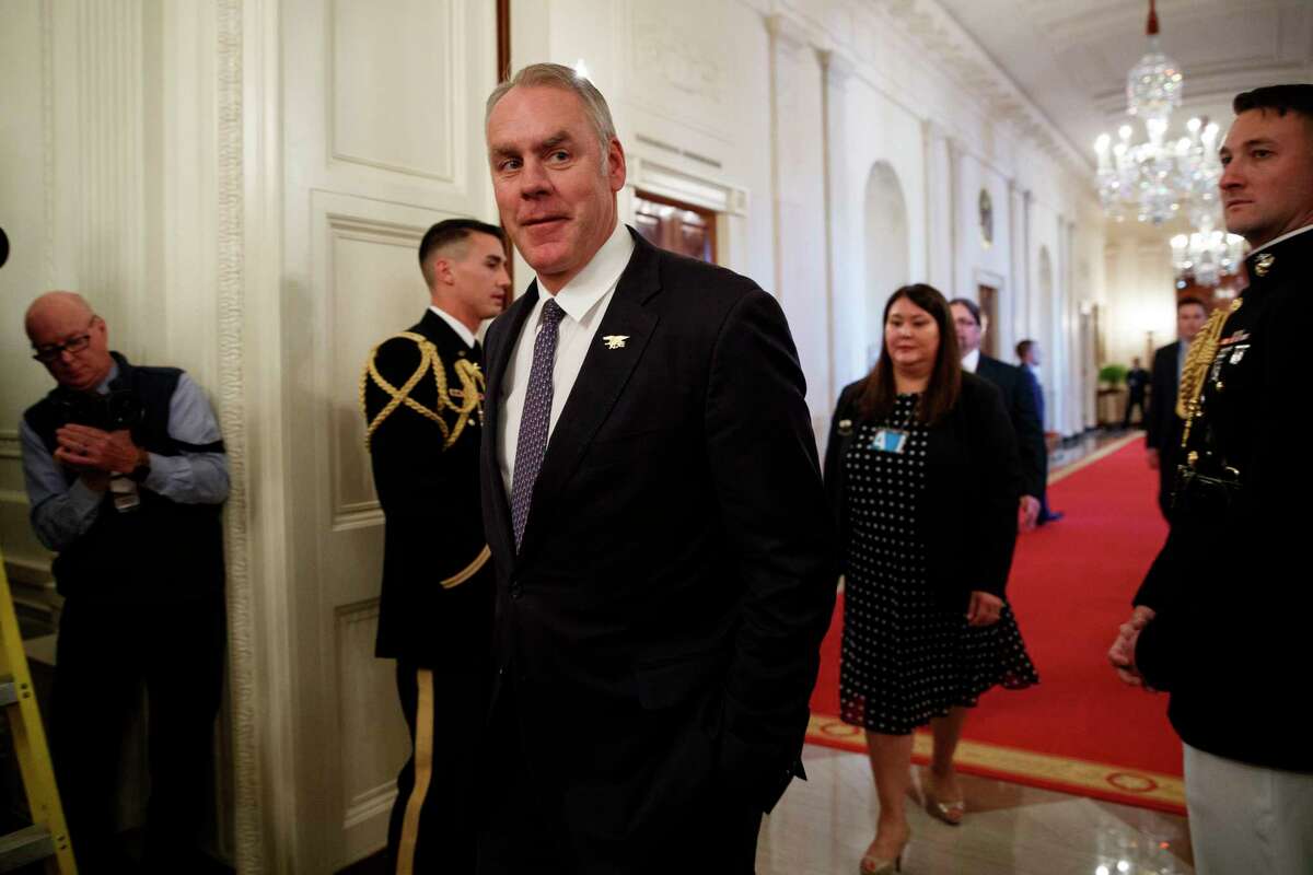 Secretary of the Interior Ryan Zinke arrives for an event with President Donald Trump on the opioid crisis, in the East Room of the White House, Wednesday, Oct. 24, 2018, in Washington.