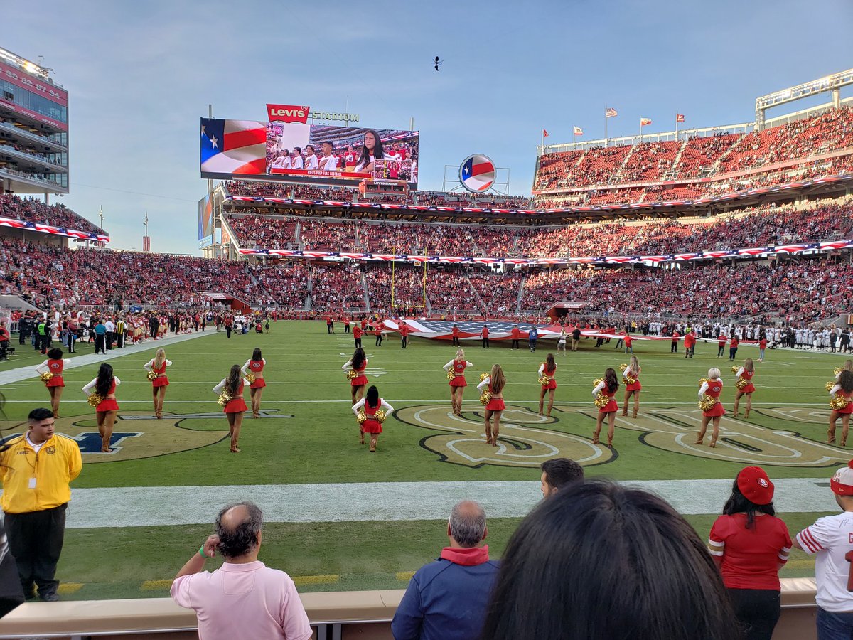 NFL cheerleader takes a knee during national anthem