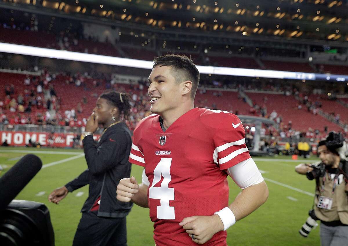 Nick Mullen (4) smiles as he runs off the field after getting his first NFL win after the San Francisco 49ers defeated the Oakland Raiders 34-3 at Levi's Stadium in Santa Clara, Calif., on Thursday, November 1, 2018.