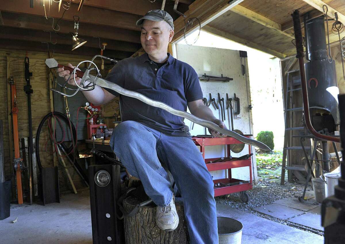 Bethel resident Rick Rabjohn with the flamberge rapier he forged on History Channels Forged in Fire. Photo Tuesday, Oct. 30, 2018.