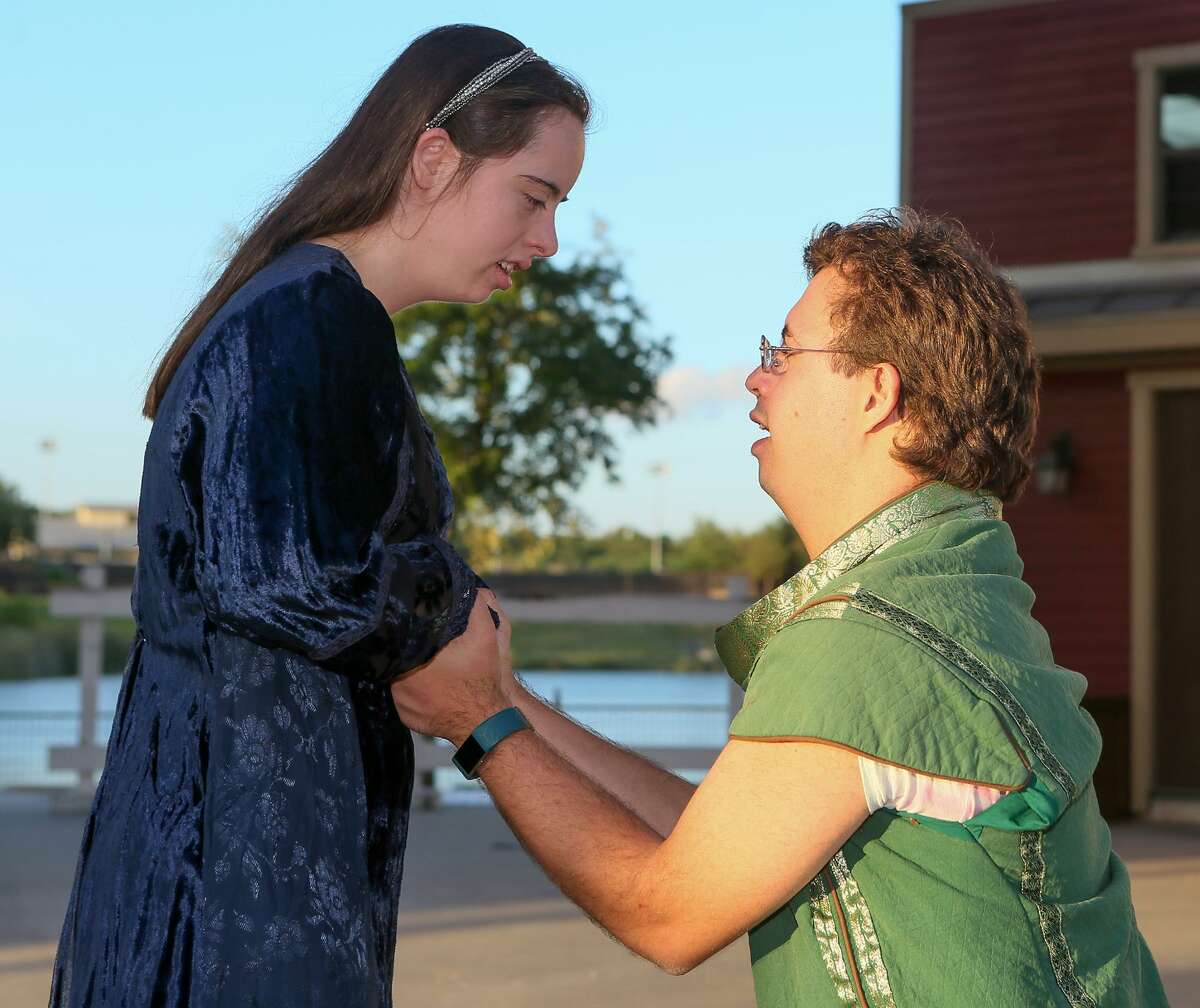 Brianna Troy, from left, 21, and Gabriel Hey, 24, portray Beatrice and Benedick in a scene from “Much Ado About Nothing.” They are a couple off-stage, as well.