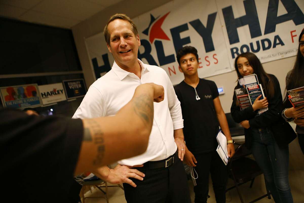 Democratic Congressional candidate Harley Rouda (CA-48), CENTER L, speaks with supporters at a Latinx campaign canvass launch on November 1, 2018 in Costa Mesa, California.