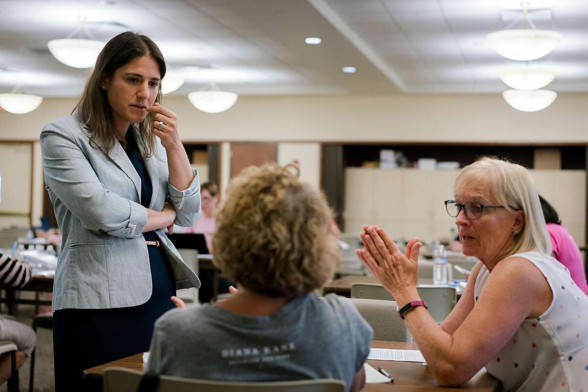 (Left) Rebecca Bauer-Kahan speaks with women at a phone bank in Walnut Creek, Calif., on Wednesday, September 26, 2018. Bauer-Kahan has taken a slight lead in returns posted Friday.