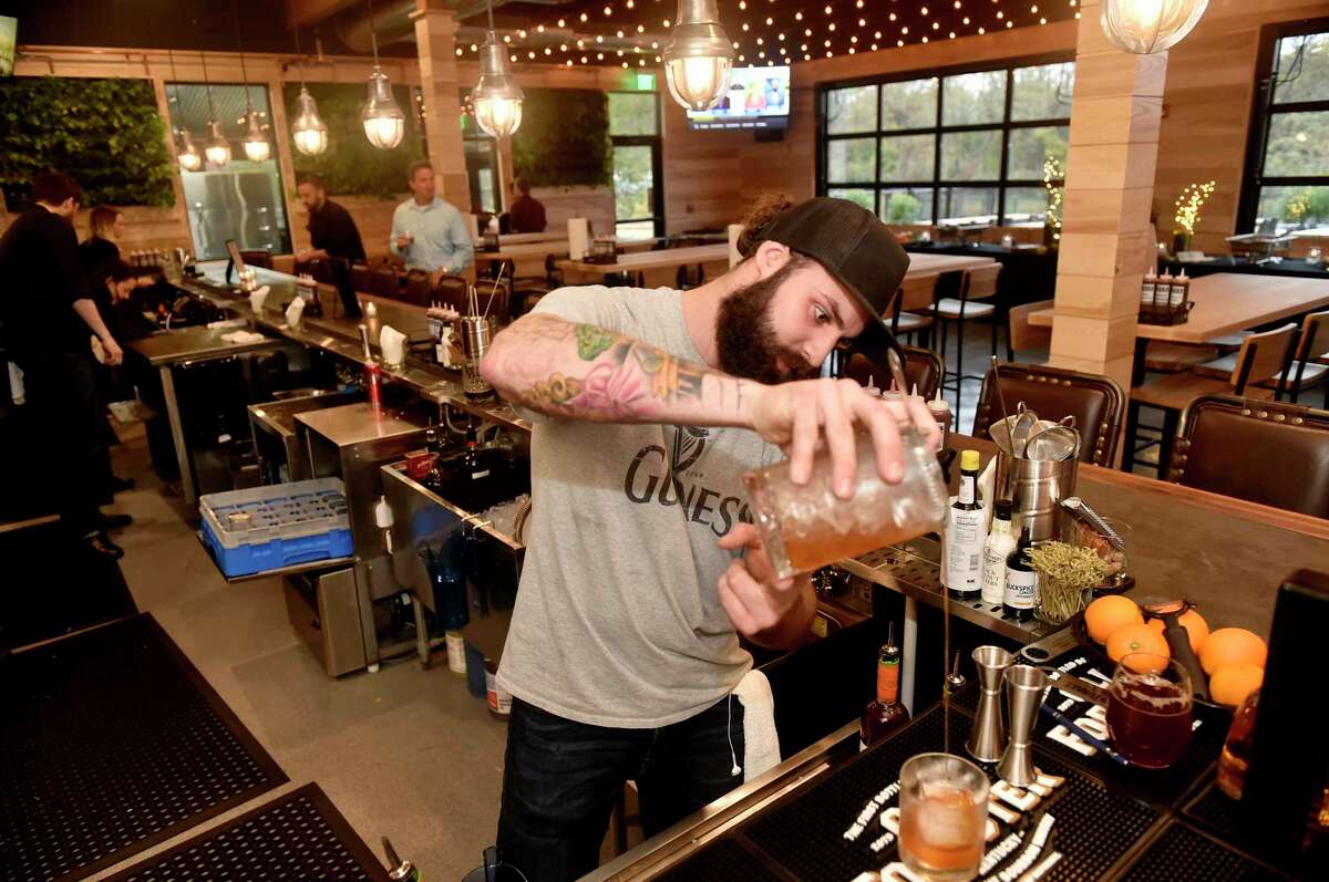 New Haven, Connecticut - Friday, November 2, 2018: Conrad Meurice, the beverage director for the Bears Restaurant Group, creates a Maple Bacon Old Fashioned craft cocktail at Stack Friday evening, the new barbecue restaurant and microbrewery at The District on James Street in New Haven.