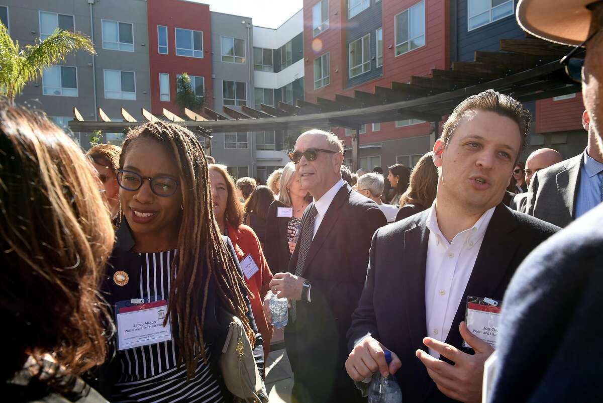 Guests mingle at the Alice Griffith housing development before a ribbon cutting ceremony, in San Francisco, CA, on Friday November 2, 2018.