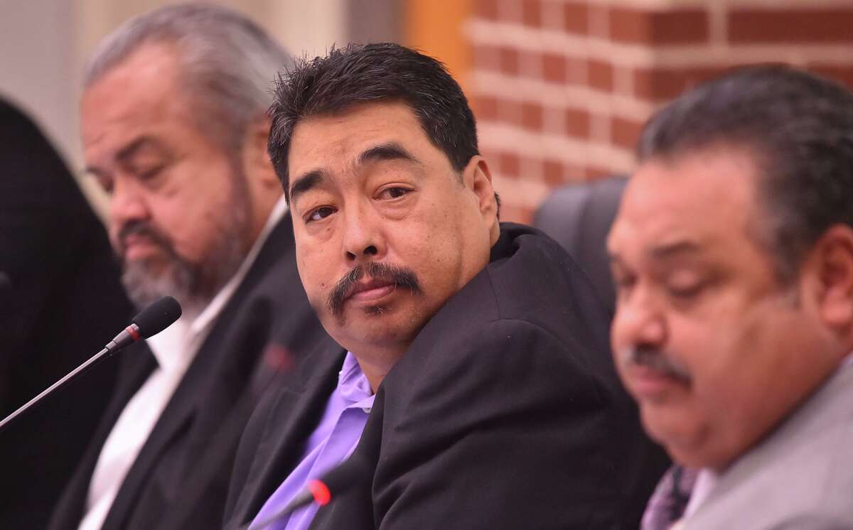Harlandale ISD trustee Juan Mancha listens to a presentation during a board meeting in October.