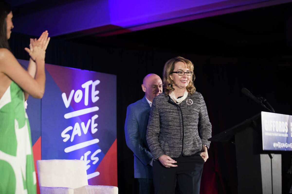Shooting victim and former Rep. Gabrielle Giffords who has partner up with March for Our Lives, arrives with her husband, NASA astronaut Mark Kelly to Hilton University of Houston to energize constituents to vote, Friday, Nov. 2, 2018, in Houston.