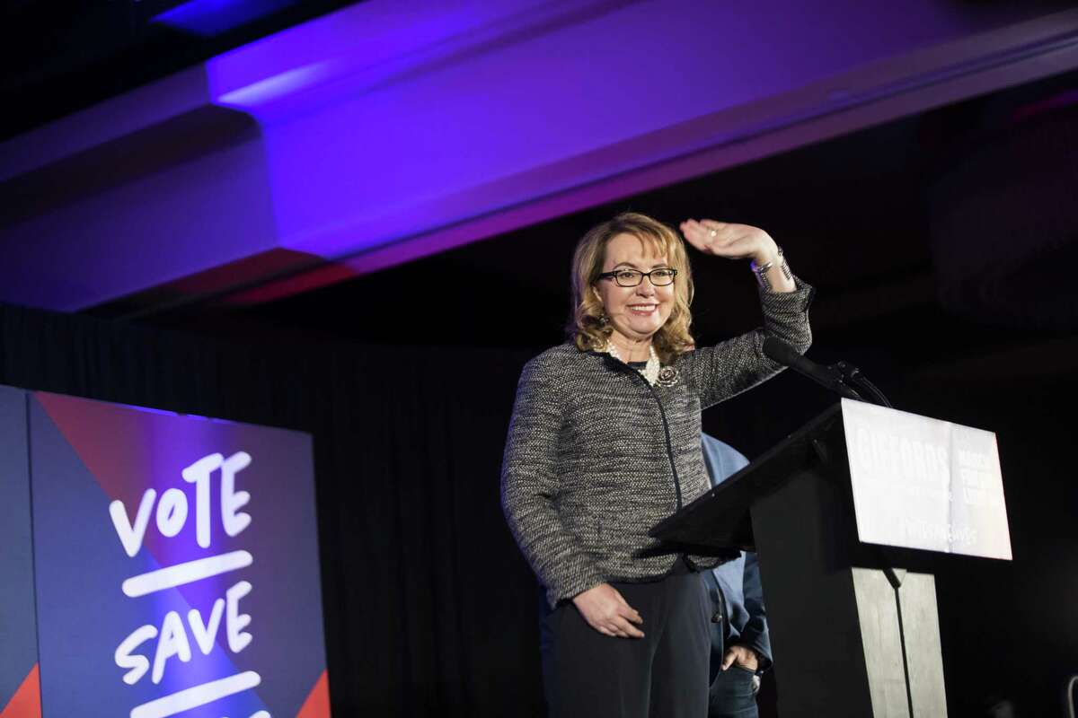 Shooting victim and former Rep. Gabrielle Giffords who has partner up with March for Our Lives, waves to her supporters before speaking about gun control ahead of the elections, Friday, Nov. 2, 2018, in Houston.