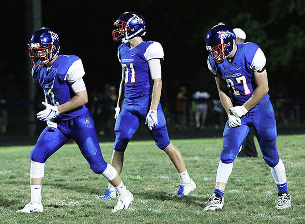Carlinville’s (from left) Colton DeLong, Kyle Dixon and Jake Ambuel have combined for more than 2,000 yards total offense and scored 46 touchdowns in the Cavaliers’ 10-0 season. The Cavs look to add to those numbers Saturday afternoon in a second-round Class 3A playoff game at Paxton-Buckley-Loda.