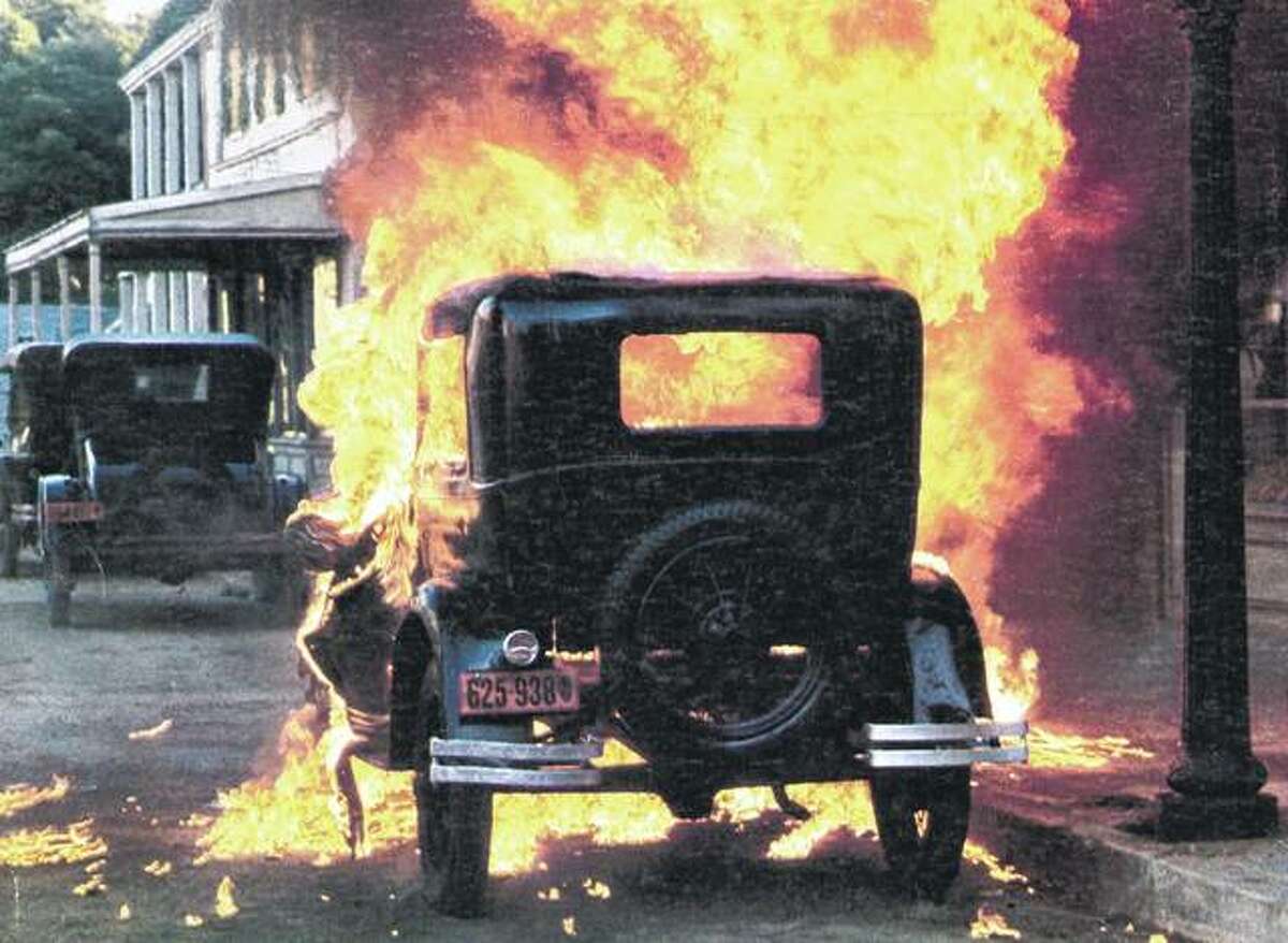 A car explodes in a scene from the 1975 film “Capone” about Al Capone, whose battles for control of Chicago’s bootlegging operations rocked the state in the 1920s and ’30s.