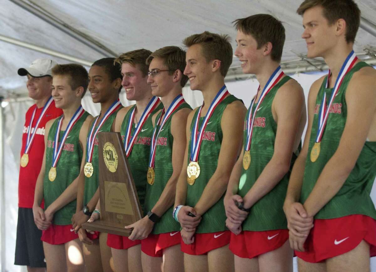 Members of The Woodlands High School varsity cross country team are seen after winning the program's fourth straight team title during the UIL State Cross Country Championships, Saturday, Nov. 3, 2018, in Round Rock.