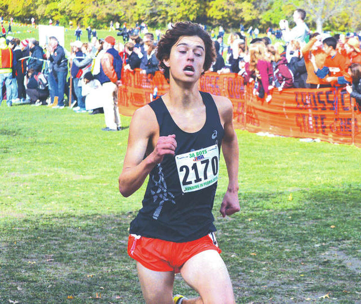 Edwardsville senior Max Hartmann approaches the two-mile mark during Saturday’s Class 3A boys’ state meet at Detweiller Park in Peoria. Hartmann finished 18th to earn All-State honors.