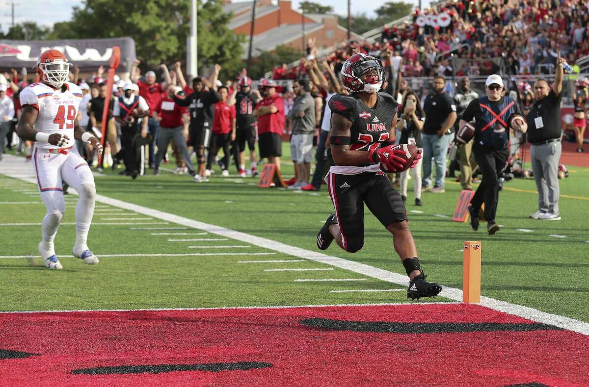 University of Incarnate Word's Ameer King (22) reacts as he scores a touchdown in the third quarter against Sam Houston State's Derick Roberson (49) in the third quarter during their football game at Benson Stadium at UIW on Saturday, Nov. 3, 2018. (Kin Man Hui/San Antonio Express-News)
