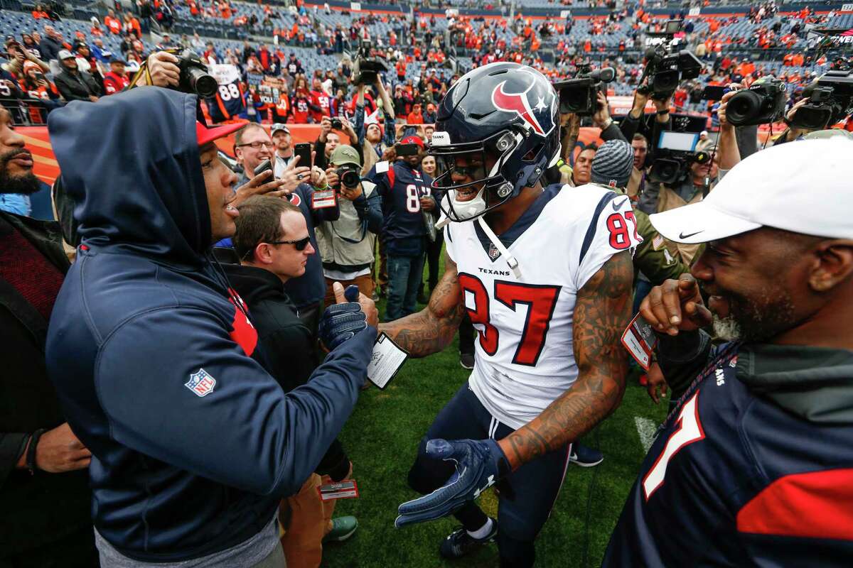 Houston Texans wide receiver Demaryius Thomas (87) greeets his friends and family on the sidelines before an NFL football game against the Denver Broncos at Broncos Stadium at Mile High on Sunday, Nov. 4, 2018, in Denver.