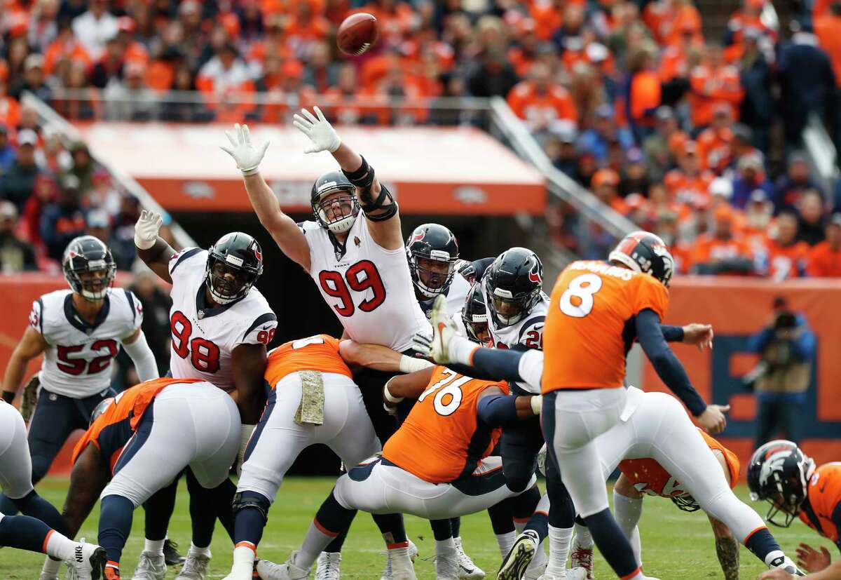 Houston Texans defensive end J.J. Watt (99) leaps to try and defend a field goal by Denver Broncos kicker Brandon McManus (8) during the first quarter of an NFL football game at Broncos Stadium at Mile High on Sunday, Nov. 4, 2018, in Denver.