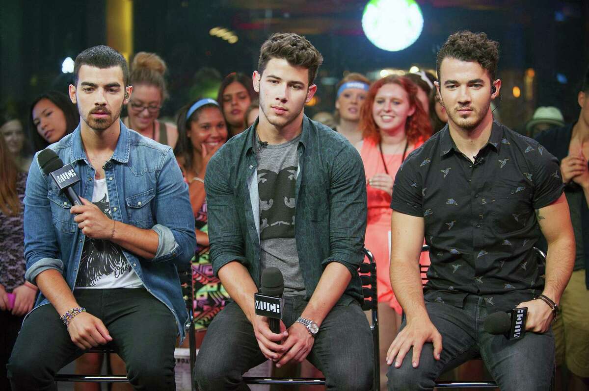 Joe Jonas, Nick Jonas, and Kevin Jonas are seen at Live at Much With Jonas Brothers at the MuchMusic Headquarters on Wednesday, July 17, 2013, in Toronto. (Photo by Arthur Mola/Invision/AP) ORG XMIT: TAM101