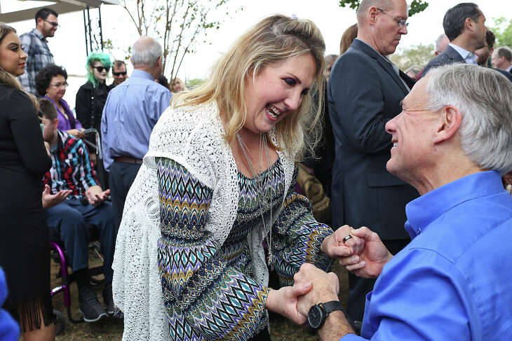 Shooting survivor Julie Workman talks with Governor Greg Abbott during Remembering Sutherland Springs: One Year Later at First Baptist Church of Sutherland Springs on Sunday, Nov. 4, 2018.