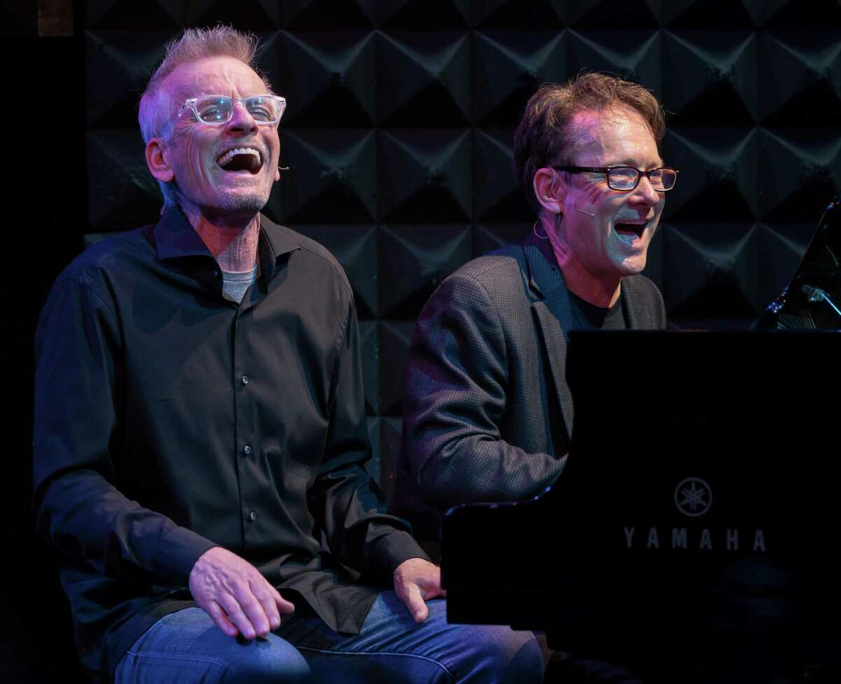 Rob Paulsen (left) and Randy Rogel perform songs from TV's Animaniacs at the Miller Outdoor Theatre on Friday.