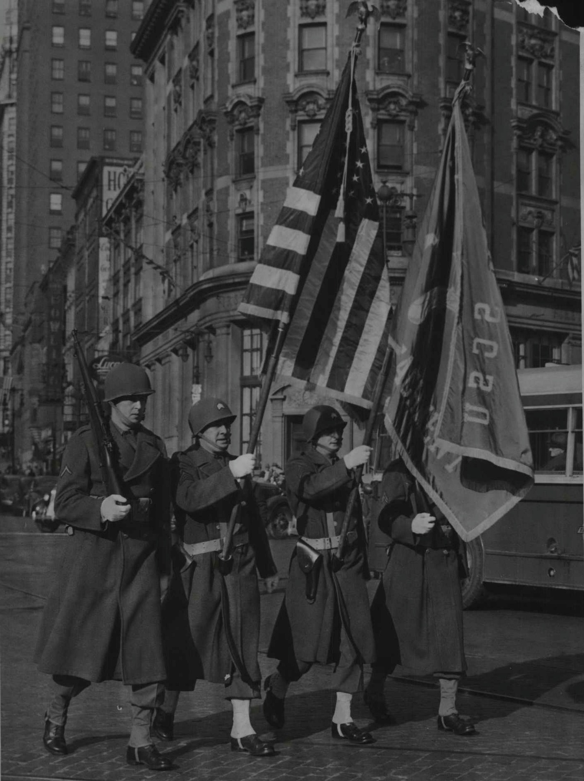 Military police color guard lead the way as Albany's Pearl Harbor Day Parade starts out from the Plaza. The parade signaled the opening of an American Legion War Bond show in the Ten Eyck Hotel, Albany, New York. December 8, 1944 (Times Union Archive)