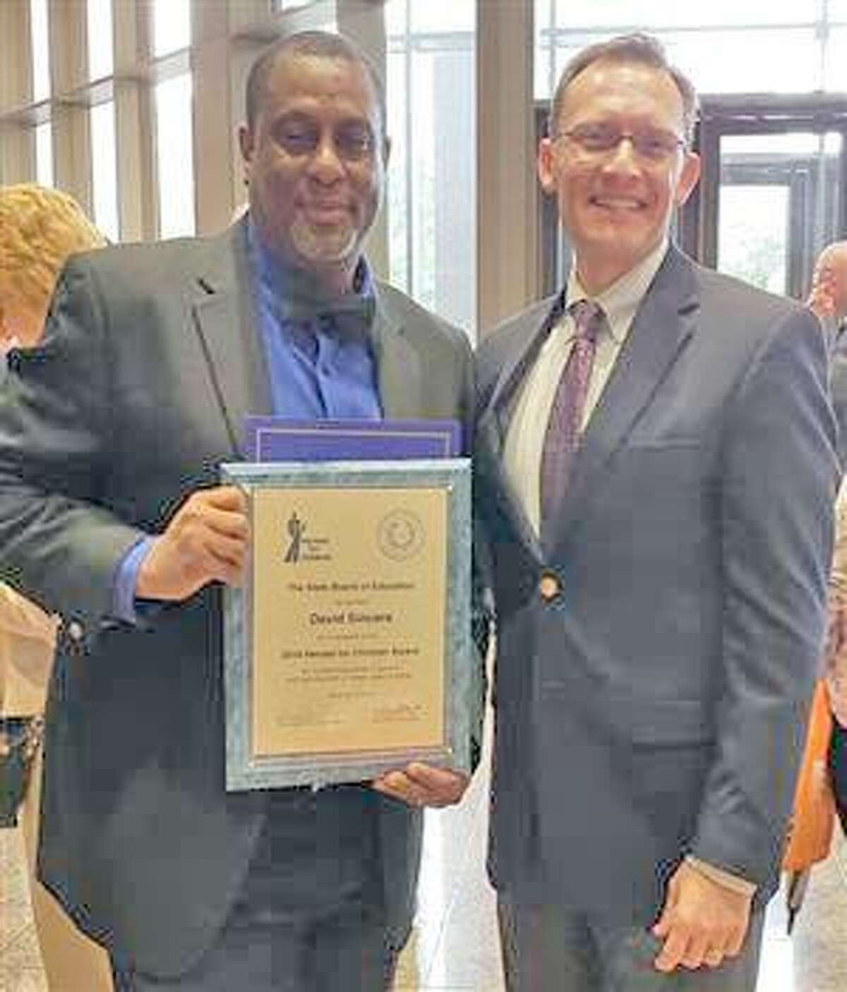Pastor David Sincere Jr. (left) was recently awarded the 2018 the 2018 Heroes for Children Award by the State Board of Education. Sincere and Anthony Indelicato, FBISD assistant superintendent of school improvement (pictured right) attended an awards ceremony in Austin.