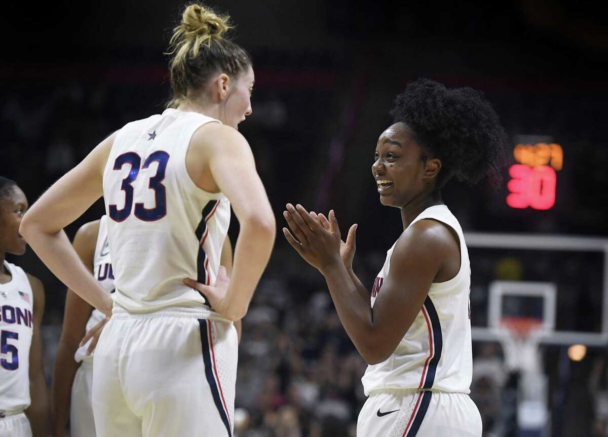 Senior Katie Lou Samuelson, left, talks with freshman Christyn Williams during the second half of UConn’s victory over Vanguard Sunday. (AP Photo/Jessica Hill)