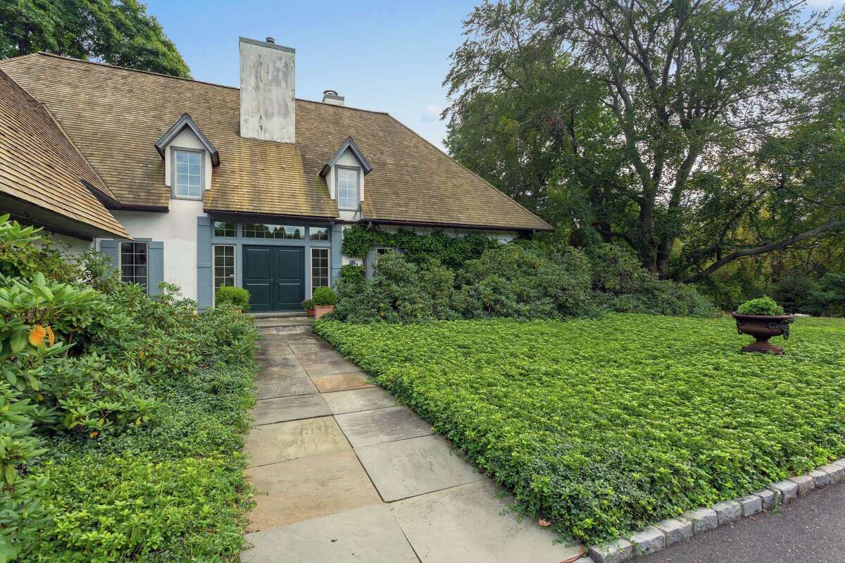 A French country cottage was built in 1980 on a portion of property originally part of the Bedford Gardens and Estate at 77 Beachside Avenue in Greens Farms.