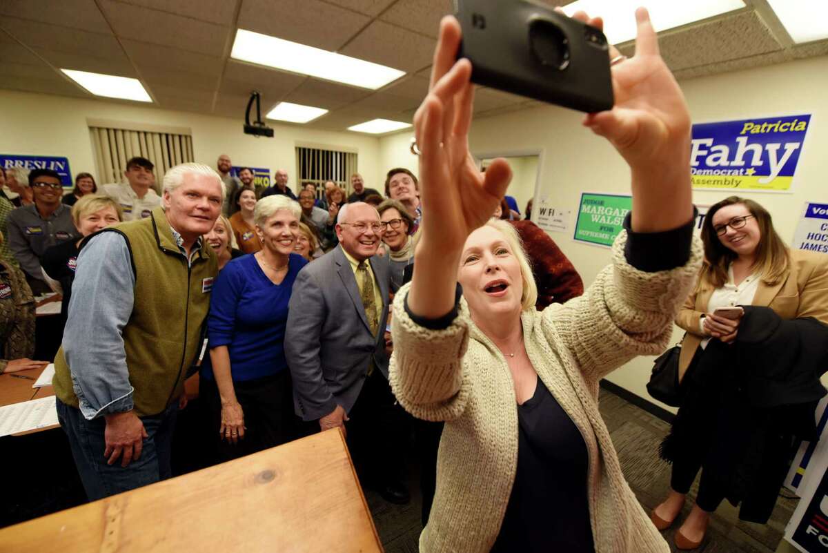 U.S. Sen. Kirsten Gillibrand takes a selfie with fellow Democratic candidates, including; Judge Peter Lynch, Pat Strong and U.S. Rep. Paul Tonko, while while meeting with volunteers at the Albany Democratic Committee headquarters on Monday, Nov. 5, 2018, in Albany, N.Y. (Will Waldron/Times Union)