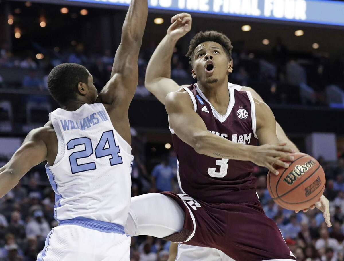 FILE - In this March 18, 2018, file photo, Texas A&M's Admon Gilder (3) drives against North Carolina's Kenny Williams (24) during the first half of a second-round game in the NCAA men's college basketball tournament in Charlotte, N.C. The Aggies guards will be led by senior Admon Gilder, who was second on the team with 12.3 points last year despite missing time with a knee injury. (AP Photo/Gerry Broome, File)