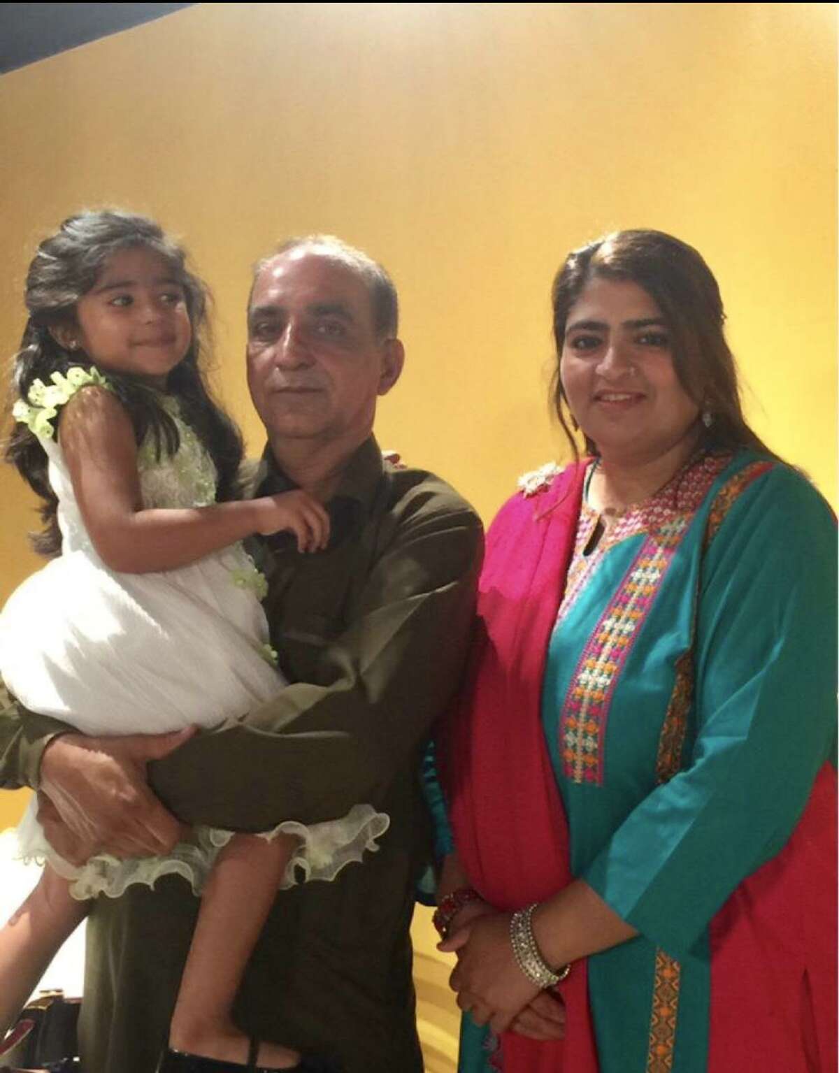 Malik Naveed bin Rehman, left, and his wife, Zahide Altaf, with their daughter, Roniya
