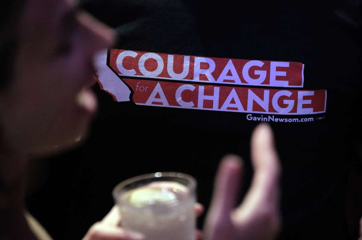 A supporter in the crowd wears a shirt with Lt. Governor Gavin Newsom's campaign slogan during an event at The Chapel the night before the midterm elections in San Francisco, Calif., on Monday, November 5, 2018. Newsroom was joined by his wife Jennifer Seibel Newsom, Senator Kamala Harris, and out-going California Governor Jerry Brown, with a quick appearance by San Francisco Mayor London Breed.