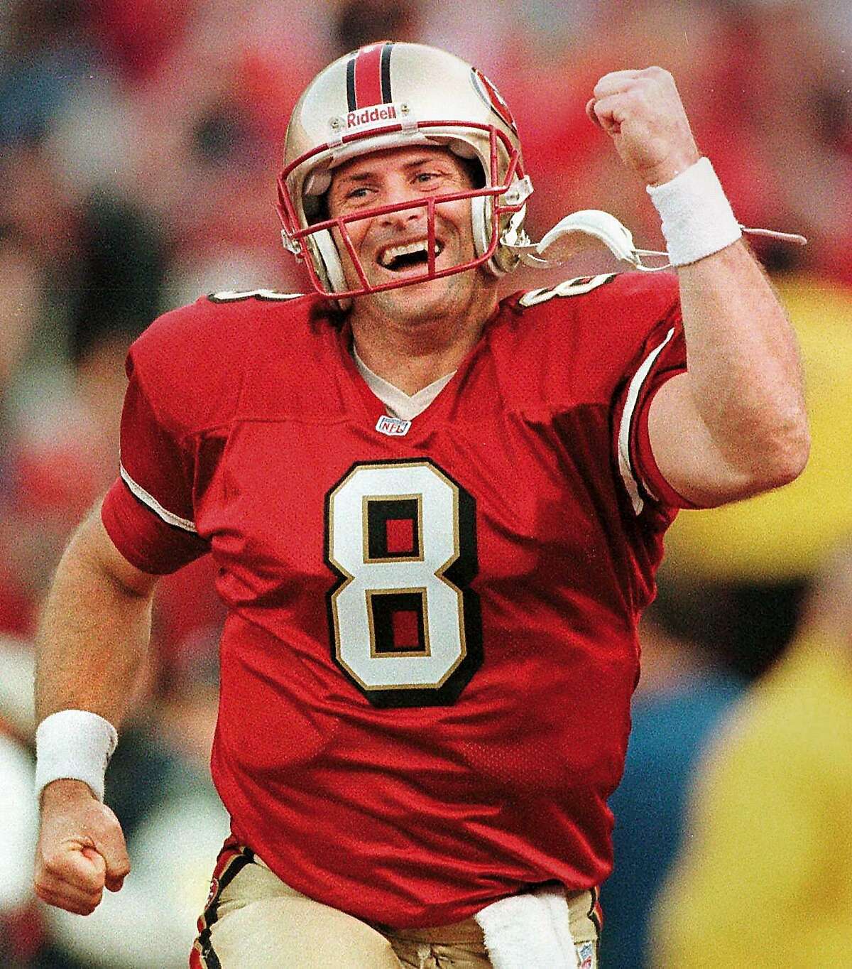 FILE -- San Francisco 49ers quarterback Steve Young reacts after throwing the game-winning pass to Terrell Owens during the fourth quarter of their game against the Green Bay Packers at 3Comm Park in San Francisco, Calif., in this Jan. 3, 1999 photo. The 38-year-old quarterback, who played with grit and heart during a 15-year career, announced his retirement Monday, June 12, 2000, in the same room where he spent his days preparing his battered body for one big game after another. (AP Photo/Milwaukee Journal Sentinel, Tom Lynn)