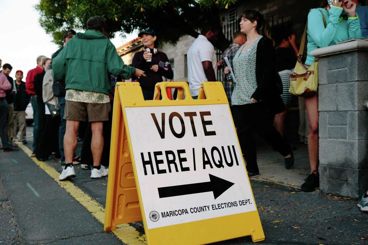 A "Vote Here" sign stands outside a polling station in Phoenix on Nov. 6, 2018.