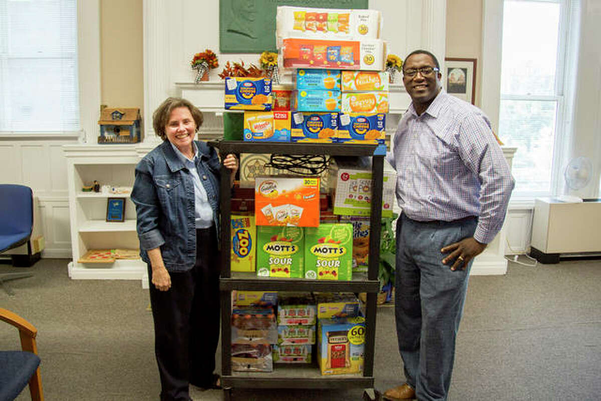 Counselor Renee Bauer and Architectural Technology/Drafting and Design Program Coordinator Joel Hall deliver a large donation to the Trailblazer Snack Pantry from the Lewis and Clark Community College Faculty Association.