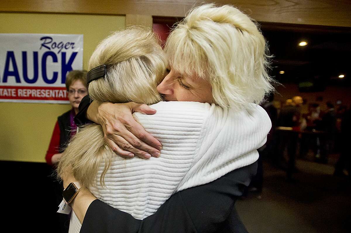 Annette Glenn, right, hugs supporter Gretchen Ziehmer, left, during a midterm election watch party for local Republicans on Tuesday, Nov. 6, 2018 at Pizza Sam's in Midland. (Katy Kildee/kkildee@mdn.net)