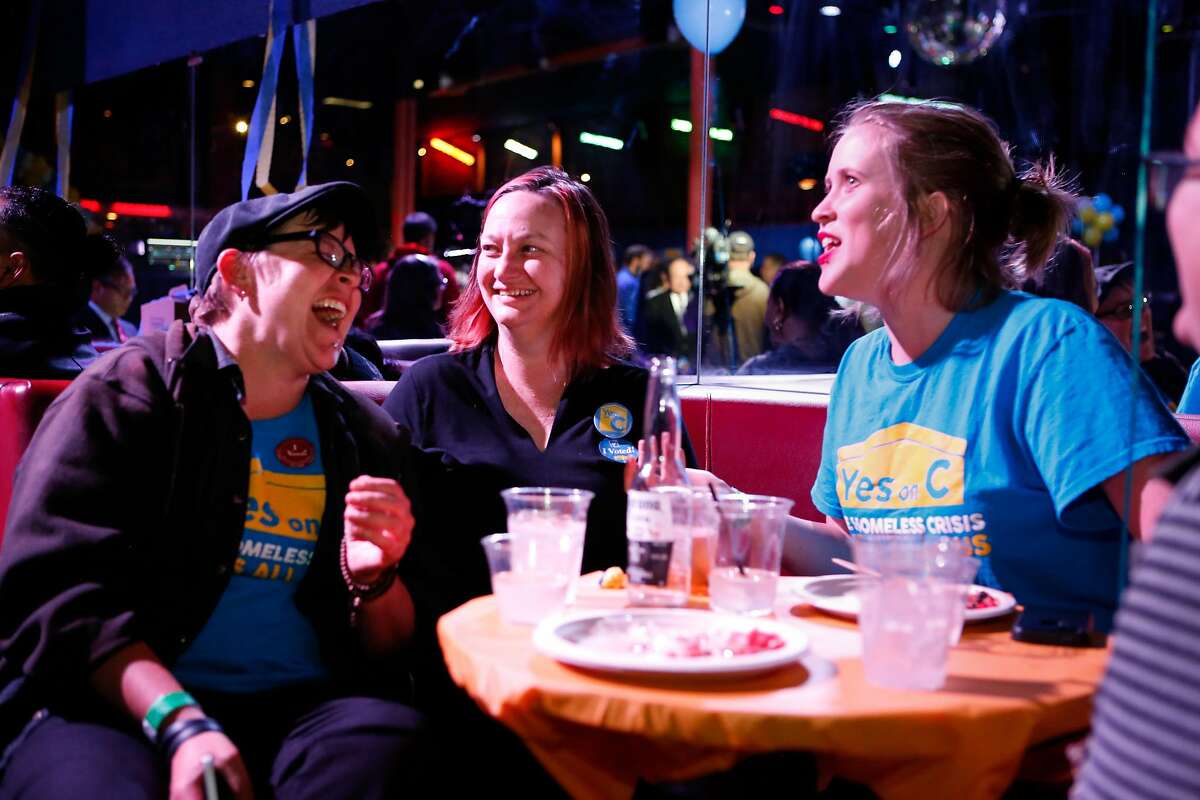 (L to R) Kelley Cutler, Christin Evans, owner of Booksmith and advocate for Prop C, and Katie Martin Selcraig are all smiles after the results at the Yes on C campaign watch party in the Mission District.