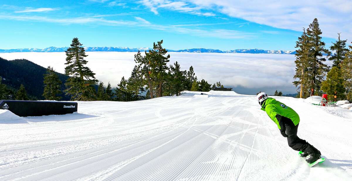 At Diamond Peak, the Crystal Ridge run provides a panorama of Lake Tahoe, here where snowboarder Erick Kertzman appears to be sailing into a giant bowl of fog below