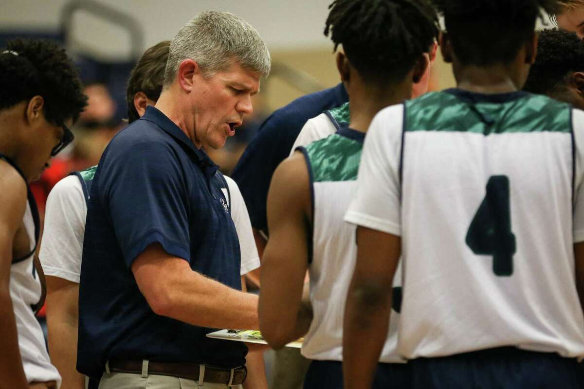 College Park head coach Clifton McNeely guides his team during the high school boys basketball game against Goose Creek Memorial on Friday, Dec. 15, 2017, at College Park High School. (Michael Minasi / Houston Chronicle)