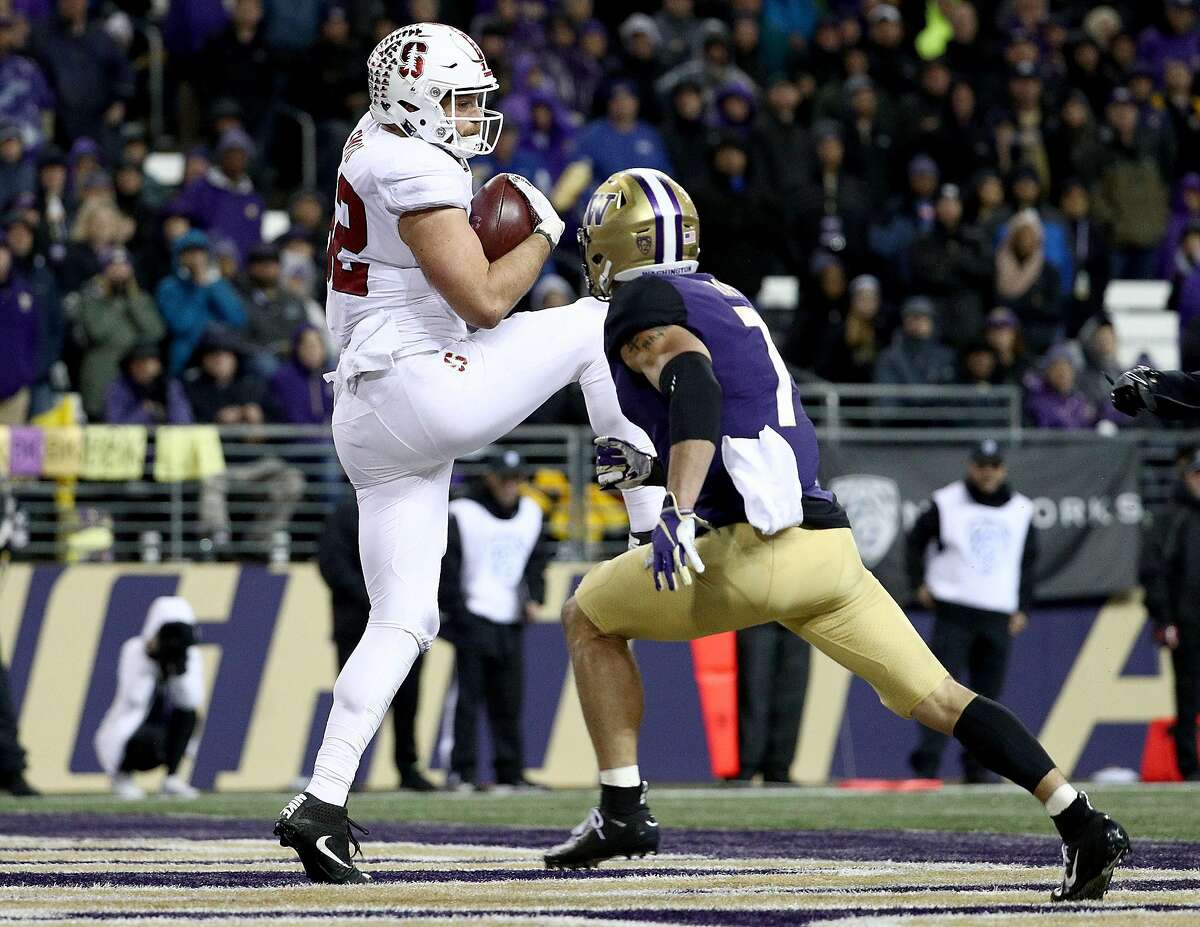 SEATTLE, WA - NOVEMBER 03: Kaden Smith #82 of the Stanford Cardinal scores a 14 yard touchdown against Taylor Rapp #7 of the Washington Huskies in the third quarter during their game at Husky Stadium on November 3, 2018 in Seattle, Washington. (Photo by Abbie Parr/Getty Images)