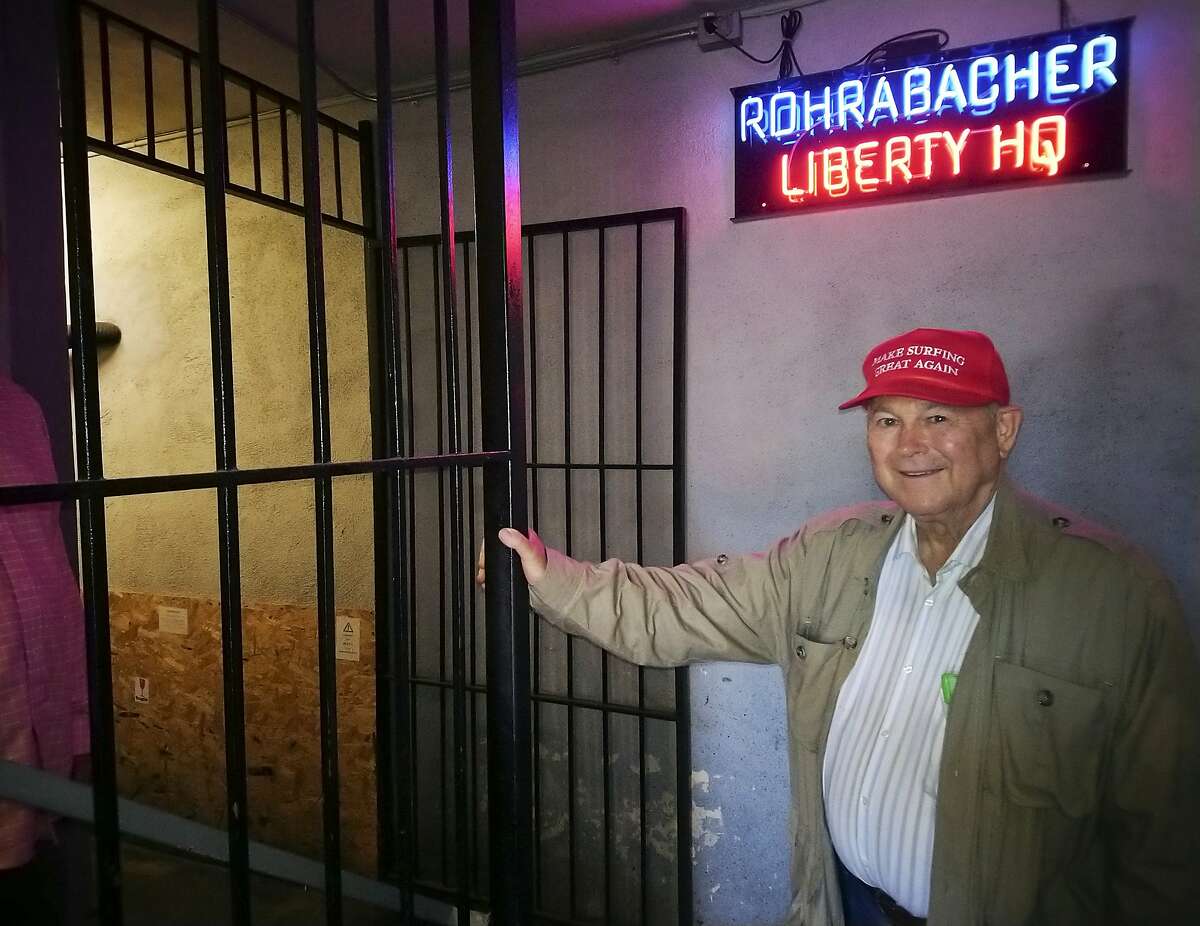 U.S. Rep. Dana Rohrabacher, R-Costa Mesa, leaves the Rohrabacher's "Liberty Headquarters" set upstairs of the Skosh Monahan's Irish Pub in Costa Mesa, Calif., Tuesday, Nov. 6, 2018. Rohrabacher was first elected three decades ago as a Reagan Republican, but he's been campaigning as a maverick willing to defy both parties. The fight for control of the House could come down to a handful of seats out West, particularly in California, where the GOP's one-time stronghold of Orange County voted for Clinton in 2016. (AP Photo/Damian Dovarganes)