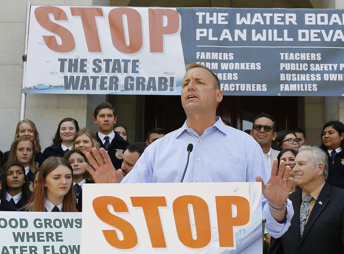 FILE - In this photo taken Aug. 20 2018 Rep. Jeff Denham, R-Calif., speaks at a rally against a proposal by state water officials to increase water flows for the lower San Joaquin River to protect fish, at the Capitol, in Sacramento, Calif. Denham is being challenged by Democrat Josh Harder for the California 10th Congressional District seat in the November election. (AP Photo/Rich Pedroncelli, File)
