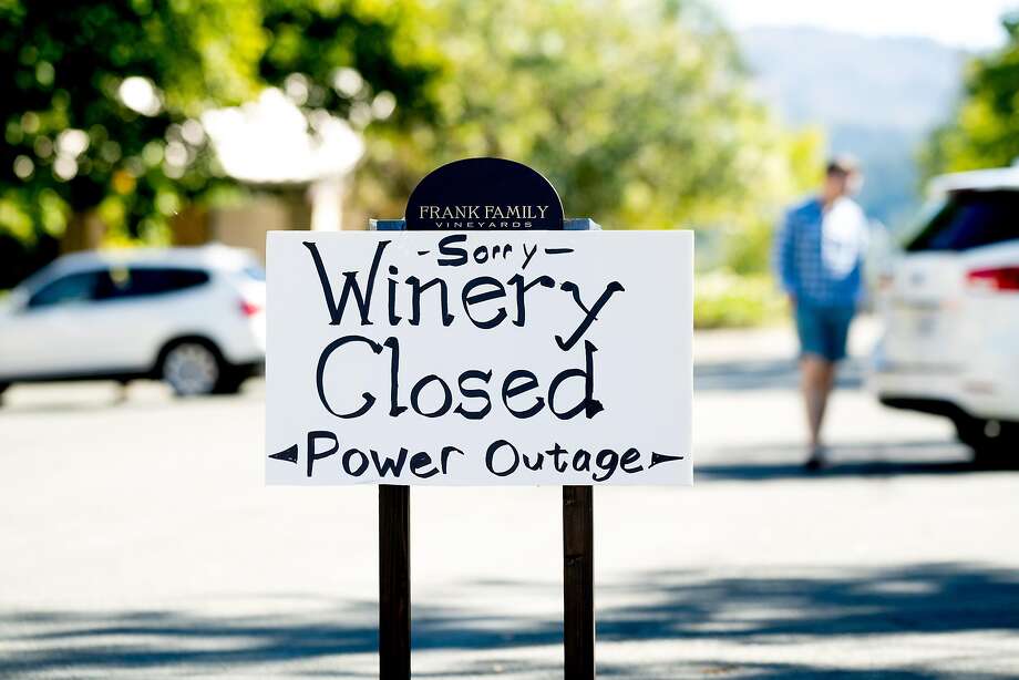 A sign announces that Frank Family Vineyards is closed due to a power outage on Monday, Oct. 15, 2018, in Calistoga, Calif. Many businesses in town remained closed after PG&E cut electric service in hopes of preventing fires amid red flag fire warnings. Photo: Noah Berger / SFC