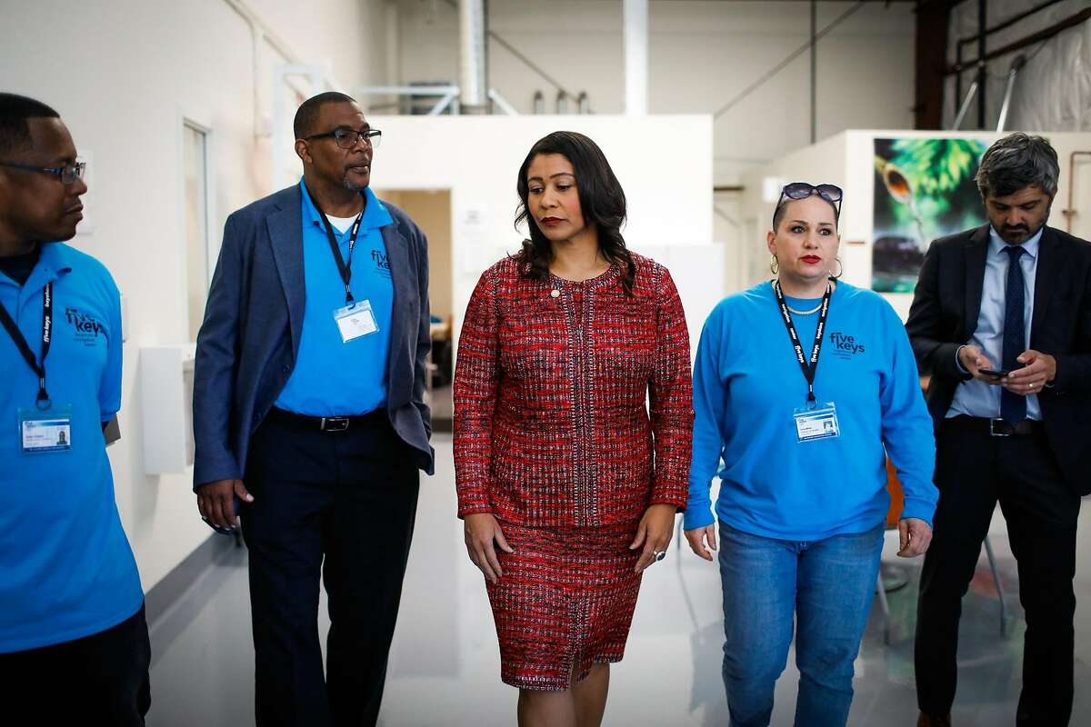 Mayor London Breed (center) takes a tour of the Bayshore Navigation Center in San Francisco, California, on Wednesday, Nov. 7, 2018.